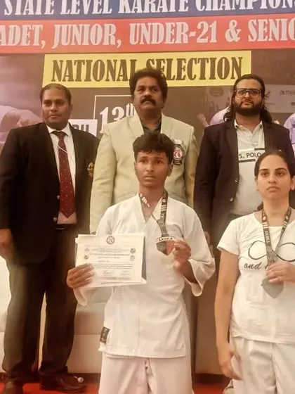 Two of my students, male and female, after receiving their medals at the 15th State Level Karate Championship for national selection.