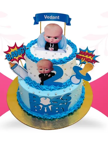 For the little boss in your life, I designed this fun, two-tier Boss Baby cake. It's a 3-pound pineapple cake, perfect for a 2nd birthday party, complete with character toppers and themed decorations that kids absolutely love.
