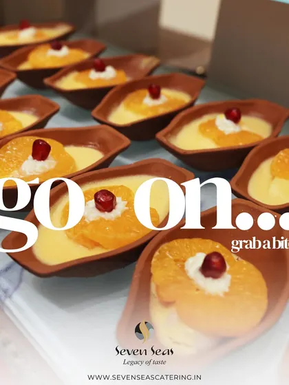 "Go on... grab a bite!" This inviting graphic features our creamy fruit custards, served in individual earthenware bowls. It's a simple invitation to indulge in a sweet, delightful treat.