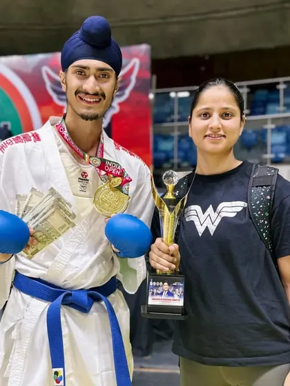 Celebrating the India Open win with my trophy and my sister, who is a constant source of support.