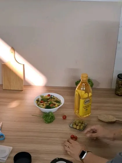 Styling the pasta salad and fresh ingredients for the Oleev oil lifestyle shot.