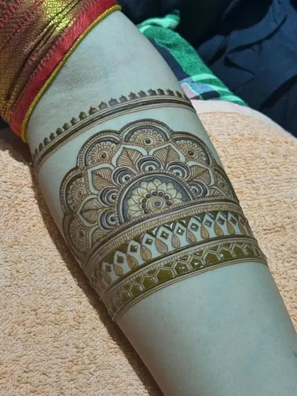 A beautiful mandala-style arm band. This kind of symmetrical design is very popular and looks like a piece of jewelry.