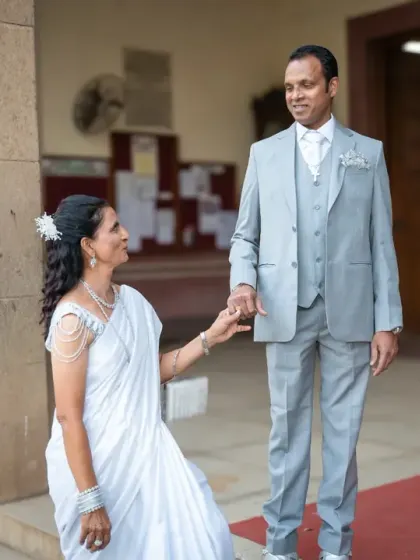 A touching moment during a silver wedding anniversary shoot. After 25 years, their connection is stronger than ever.