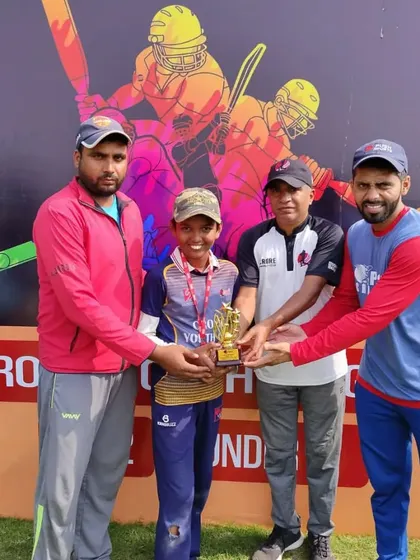 Aarav Srivastava, Man of the Match, with the coaches. His 5-wicket haul was an exceptional performance.