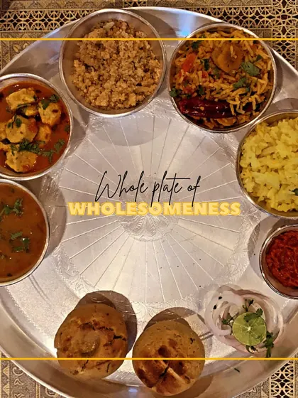 This is what a plate full of love and tradition looks like. Our Rajasthani thali features classics like baked baati, gatte ki sabzi, and churma, offering a complete, wholesome meal that tastes just like home.