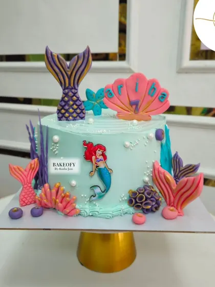 Dive into the magic with our mermaid-themed cake. This design features Ariel, colorful coral, and shimmering mermaid tails to create a perfect under-the-sea celebration.