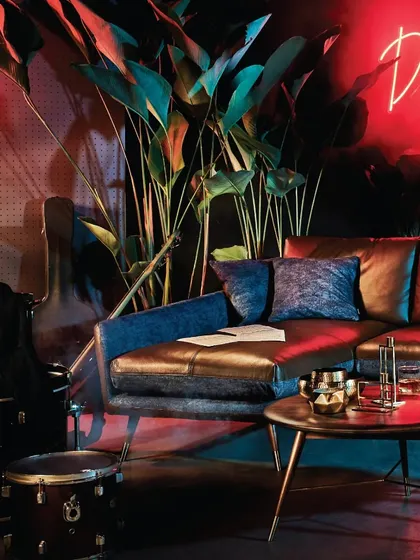 Another view of the Volta Sofa, perfectly styled for a modern "man cave" or music room. The design is confident and sophisticated, blending seamlessly with creative and expressive interiors.