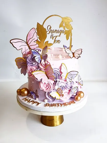 Another gorgeous butterfly cake, this time for Shanaya's 10th birthday. The combination of pink and purple rosettes with gold-accented butterflies is simply magical.