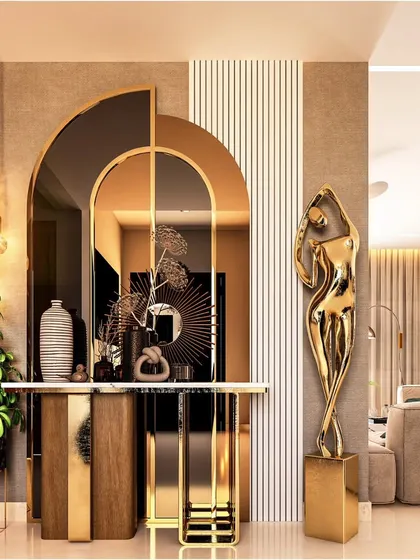 This entryway exudes modern artistry with its layered arched mirrors and a sleek console table. A golden abstract sculpture adds a touch of sophistication, setting a luxurious tone for the rest of the home.