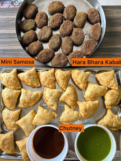 A classic snack platter with Mini Samosas and Hara Bhara Kebabs, served with sweet and spicy chutneys.