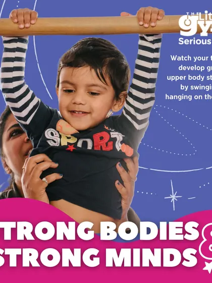 Hanging on the bars is more than just play; it's a fundamental exercise for developing grip and upper body strength in toddlers. With a parent's supportive hands, children learn to trust their own strength and build the confidence to try new things.