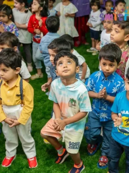 A group of boys stands together, fully engaged in the day's events. Our celebrations foster a strong sense of community and friendship.