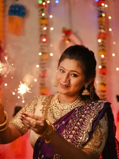 Celebrating Diwali with sparklers, this image captures the joy and light of the festival.