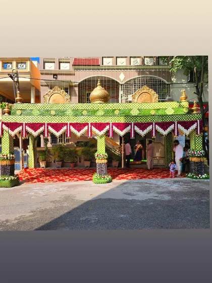 A wide view of a wedding chappara, showing how it transforms the entrance of a house. This is a highly sought-after skill in the event decoration industry.