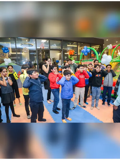 Look at the focus and fun! Party games are a huge part of the experience, bringing all the kids together for some shared laughter and friendly competition.