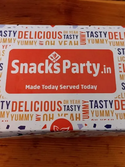 Our printed snack-box lid carries the words "Made Today Served Today" in the middle of a red-and-white food-themed design.