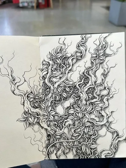 A detailed ink drawing of tangled vines and leaves from my sketchbook. I often get lost in drawing these natural patterns, which find their way into many of my larger compositions.