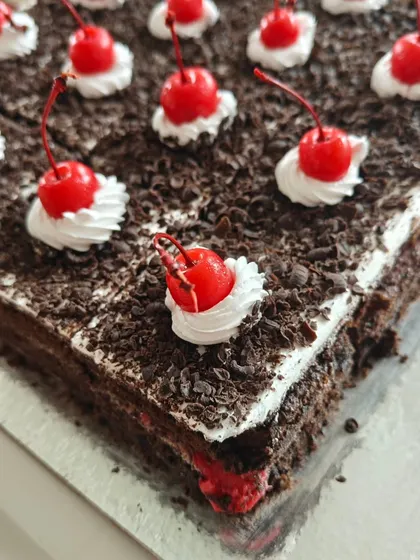 A timeless classic, our Black Forest pastry. Layers of chocolate sponge, fresh cream, and cherries are topped with chocolate shavings and a signature cherry.
