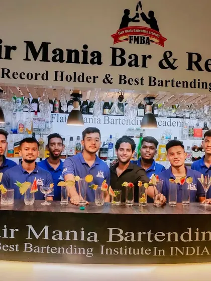 Students from our Best Bartending Institute in India award-winning academy, showcasing their garnished glasses.