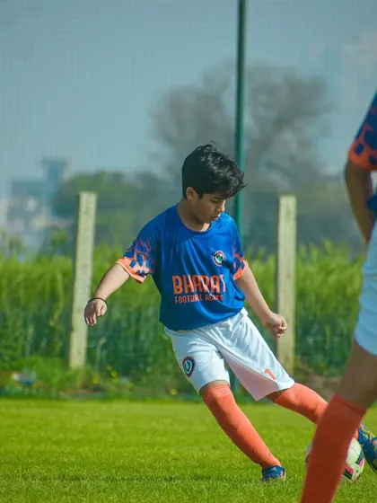 Meet Samarth Jain, a talented left footer with incredible vision. This image shows his focus as a midfield maestro, a skill he has honed over three years with us.
