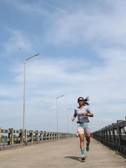 The run leg is a battle against yourself. Here I am on the run course in Malpe, focused on pacing and nutrition to manage the heat. Every aid station becomes a strategic part of your race.