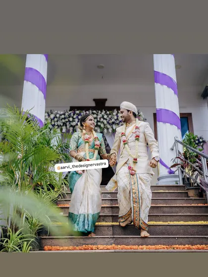 Walking together into their future. The couple looks stunning in their coordinated wedding outfits.