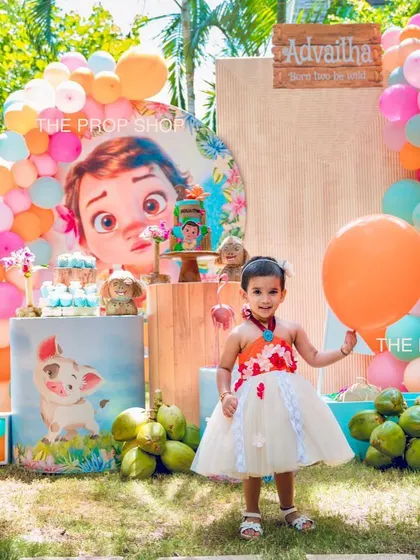 We bring beloved movie themes to life with incredible detail. This outdoor Moana-themed birthday party features a custom character backdrop, themed props, and vibrant balloon arrangements that capture the spirit of the ocean adventure.