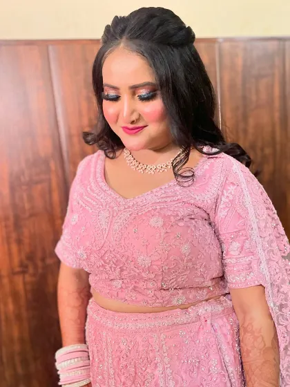 The final look, with the bride looking down to show off her beautiful eye makeup.