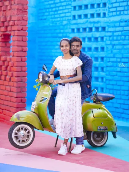 A fun and playful shot with a vintage green scooter against a colorful wall. Props are a great way to add personality to your photos.