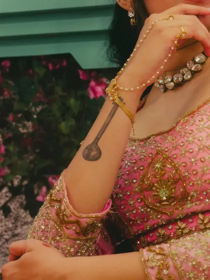 A close up of my Tamburi tattoo and the beautiful details of my outfit for a show. Music is a part of me, literally.