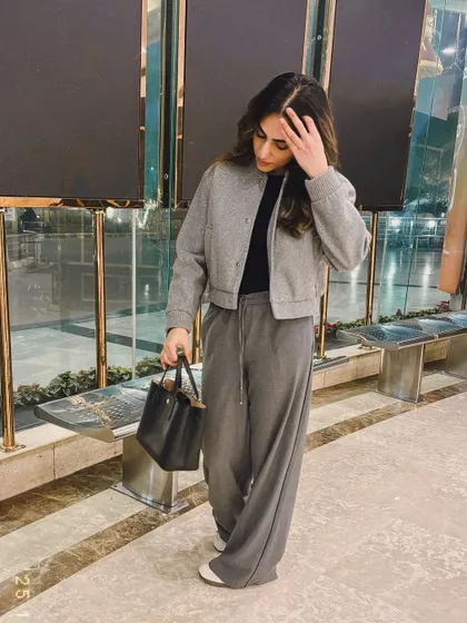 A full-length shot of my cozy grey winter outfit.
