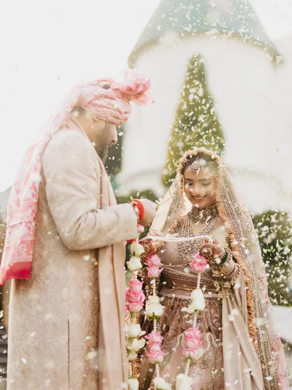 A dreamy, light-filled shot from Vasav's varmala ceremony. Her glowing makeup looks absolutely radiant, even in this artistic, overexposed photo.