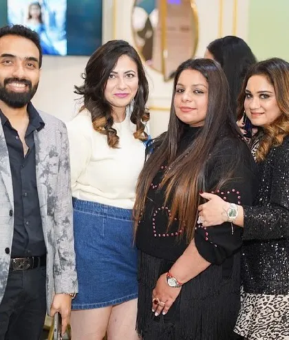Guests mingling and posing for photos in our modern and bright cafe area.