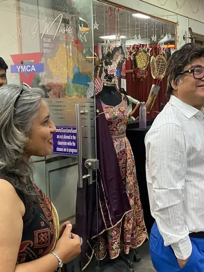 Our director and guests enjoy the creative atmosphere of the student exhibition, appreciating the hard work and talent on display.
