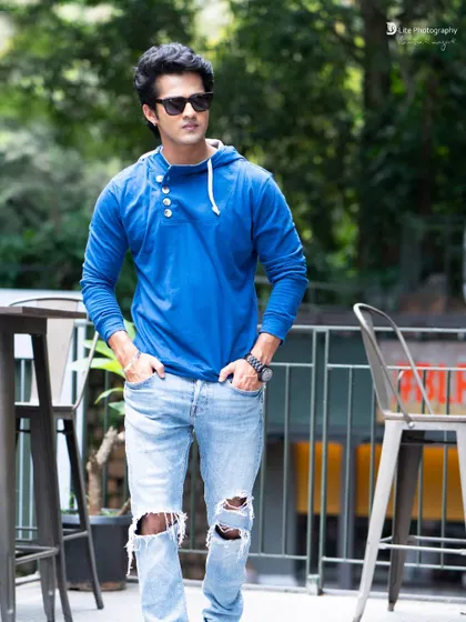 A full-body casual shot of Bharath Bopanna. This style is perfect for fashion lookbooks or for showing a model's natural presence.