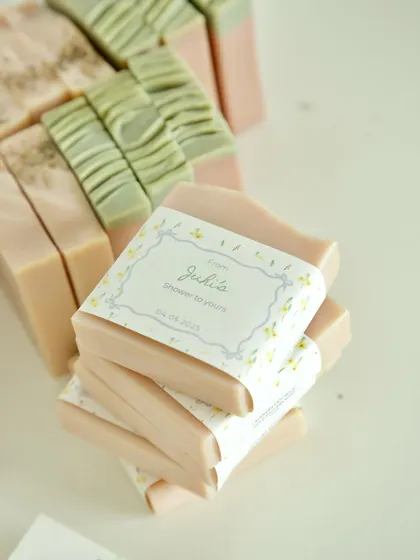 A stack of the pastel-colored soaps, showing the variety of bars included in the Amsterdam baby shower order.