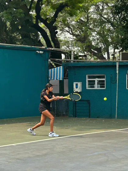 A player prepares for a powerful forehand during the MSSA tournament finals.