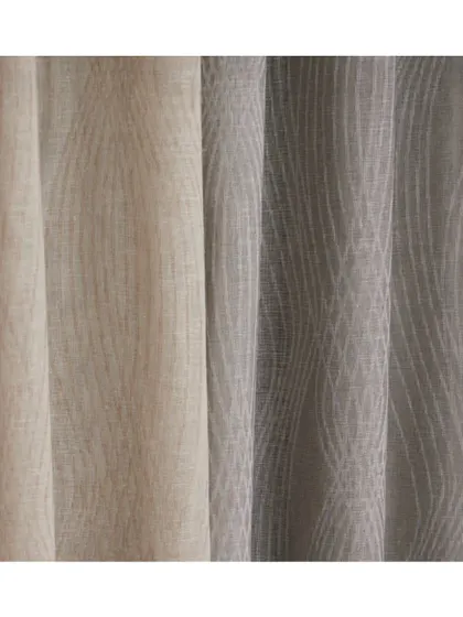 'Cora' is a jacquard woven textured sheer featuring an interlaced wave pattern. Available in five neutral colourways, it adds a subtle, organic movement to window treatments in a wide array of interiors.