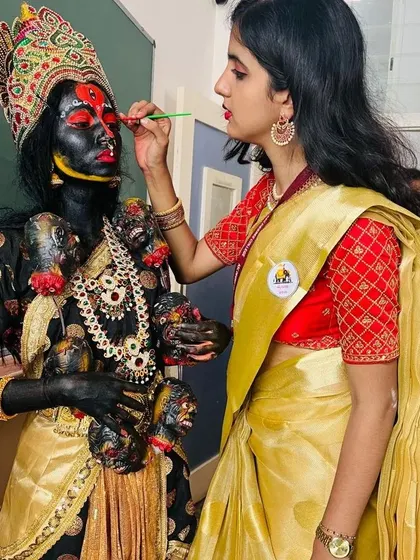 A closer look at the fine brushwork required for the Kali transformation. Every detail is meticulously painted to achieve a dramatic and authentic appearance for theatrical performances.
