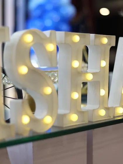 A close-up of the illuminated marquee letters we use to personalize your event. These letters add a beautiful glow and are a great photo opportunity for guests.