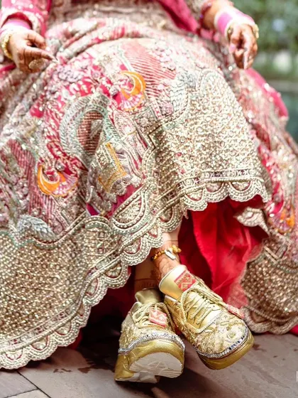 A fun shot of the bride's embellished sneakers.
