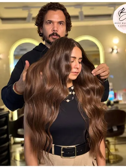 A closer look at this stunning brown hair color. The soft waves showcase the multi-dimensional tones and the incredible shine we achieved.
