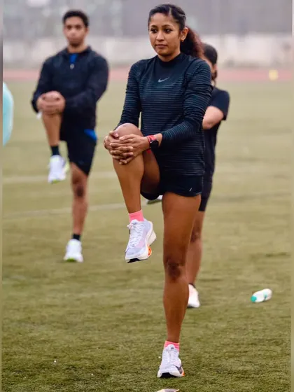Leading a warm-up at a Nike running session. Proper preparation is key to a successful workout and preventing injury.