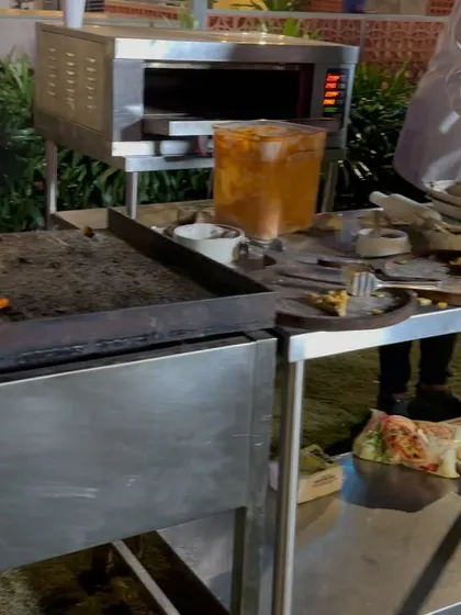 We can arrange for live cooking stations, like this pizza oven, to add a special touch to your corporate event's dining experience.