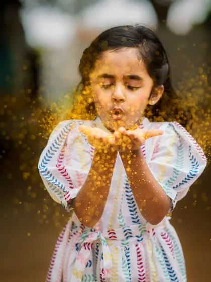 Let your wishes fly. A glitter-blowing shot is a fun and magical way to add some sparkle to any photoshoot.