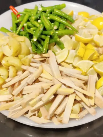 A plate of chopped ginger, amla, green chillies, and lemon. This is the base for one of our healthiest and most flavourful mixed pickles.
