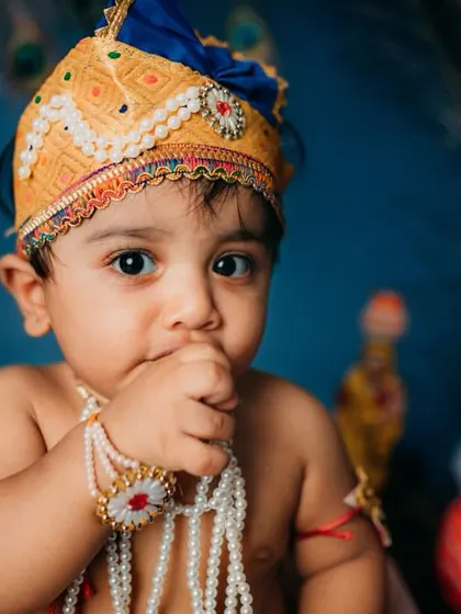 A duplicate of the previous image, this shot captures the baby's adorable habit of putting his hand to his mouth, a natural and cute pose during his themed session.