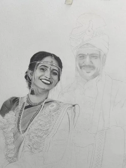 Here, the bride's portrait is partially shaded, showing the careful layering of graphite I use to create the texture of her saree and the shine of her jewelry.