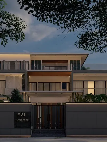This view of 'Zen Oasis' at night shows how the interior and exterior lighting work together. The warm glow from inside makes the home feel transparent and connected to its darkened landscape.