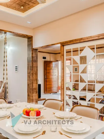 A wider view of the dining and living space, showing the seamless integration of the modern dining set, the traditional swing, and the custom geometric screen.